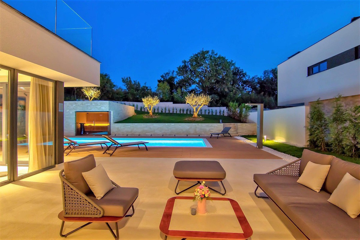 Outdoor concrete poolside shower  - PHOTO BY OWNER